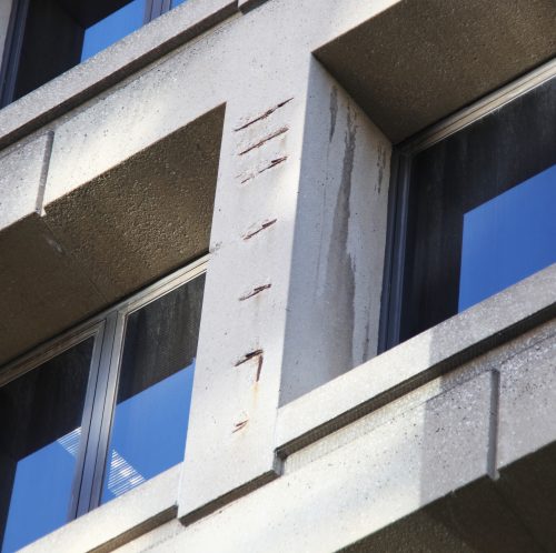 Damaged_concrete_on_east_facade_-_J_Edgar_Hoover_Building_-_Washington_DC_-_2012